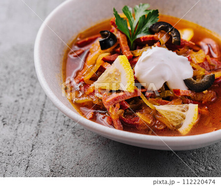 meat and salt soup Solyanka in bowl 112220474