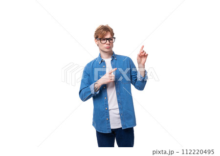 young european guy with red hair wears glasses for image. people lifestyle concept young european guy with red hair wears glasses for image. people lifestyle concept 112220495