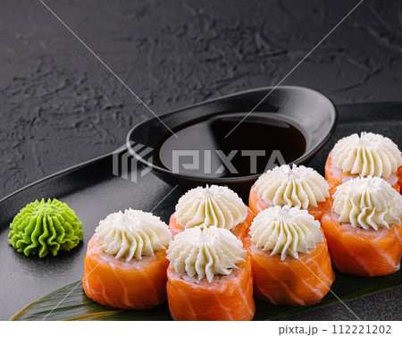 Philadelphia Sushi with Philadelphia Cheese on Black Asian Plate 112221202
