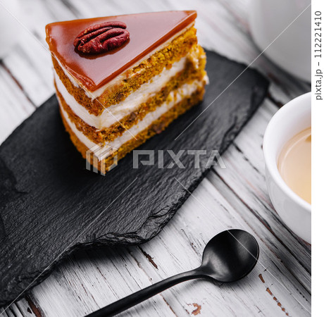 Delicious cheesecake with caramel and walnuts 112221410