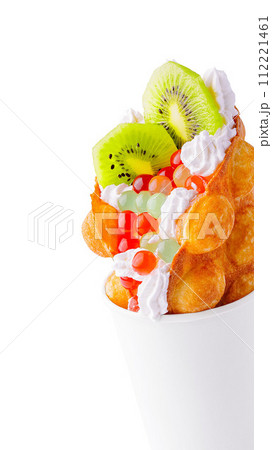 Bubble Waffle with kiwi, bubble tea and whipped cream Bubble Waffle with kiwi, bubble tea and whipped cream 112221461