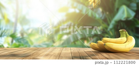 Ripe Bananas on Wooden Table in Tropical Setting Ripe Bananas on Wooden Table in Tropical Setting 112221800