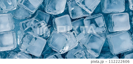array of glistening ice cubes in various shapes and sizes fills this wide banner image. detailed textures and transparent nature of the ice cubes. cold and refreshment, marketing disign 112222606