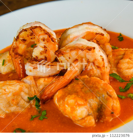 Recipe for Armorican-style monkfish tail, prawns, flambees with cognac Recipe for Armorican-style monkfish tail, prawns, flambees with cognac 112223076