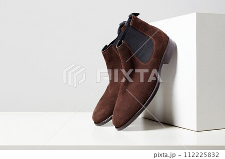 fashion female shoes still life. stylish brown chelsea boots fashion female shoes still life. stylish brown chelsea boots 112225832
