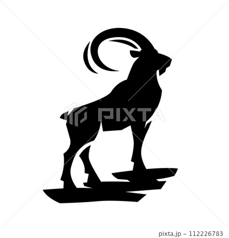 A mountain goat stands on a rock. 112226783