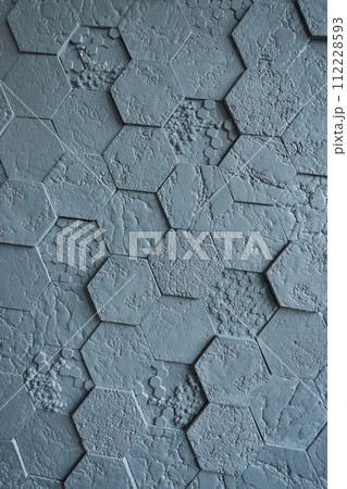 Background made of grey hexagonal gypsum tiles, textured, mosaic. 112228593