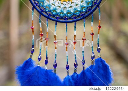 Handmade dream catcher with feathers threads and beads rope hanging Handmade dream catcher with feathers threads and beads rope hanging 112229684