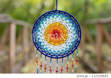 Handmade dream catcher with feathers threads and beads rope hanging 112229685