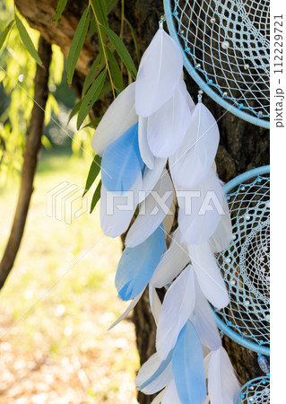 Handmade dream catcher with feathers threads and beads rope hanging 112229721