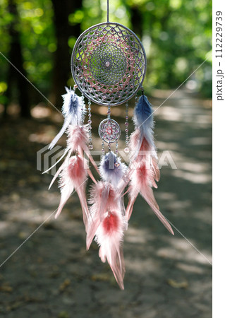 Handmade dream catcher with feathers threads and beads rope hanging Handmade dream catcher with feathers threads and beads rope hanging 112229739