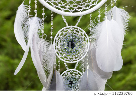 Handmade dream catcher with feathers threads and beads rope hanging 112229760