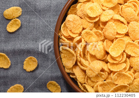 Corn flakes for breakfast close-up, top view 112230405