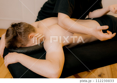 Chiropractic, osteopathy, manual therapy.Therapist doing healing treatment on man's back. Alternative medicine, pain relief concept Chiropractic, osteopathy, manual therapy.Therapist doing healing treatment on man's back. Alternative medicine, pain relief concept 112230833