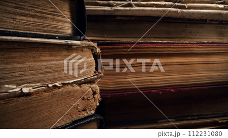 Old books in antique shop or abandoned library. Macro footage. Bookstore 112231080