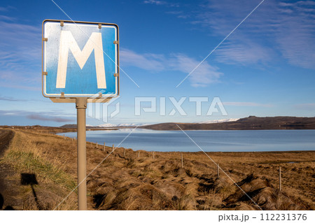 Fjord, mountains and a traffic sign, Iceland Fjord, mountains and a traffic sign, Iceland 112231376