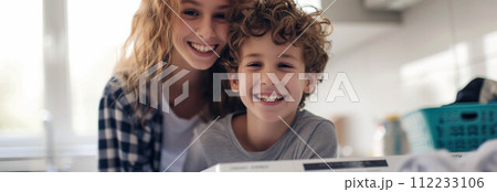 Caucasian mother and son washing clothes together in the house. 112233106