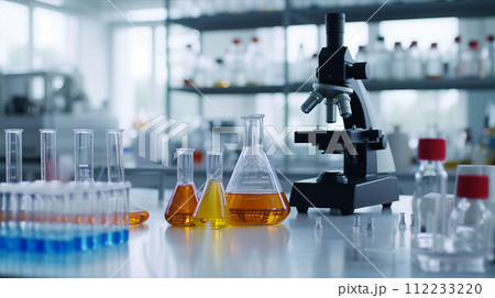 Test tubes, beakers, microscope in white lab. 112233220