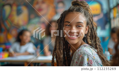 Children Sitting at Table in Classroom 112235269