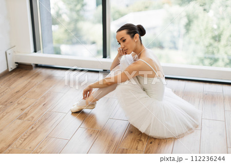 Side view portrait of talented ballerina finished her wonderful performance. 112236244