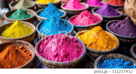 Holi vibrant powder in a bowls on counter. Bright hues of colorful powder. Indian Holi festival of colors, background Holi vibrant powder in a bowls on counter. Bright hues of colorful powder. Indian Holi festival of colors, background 112237412