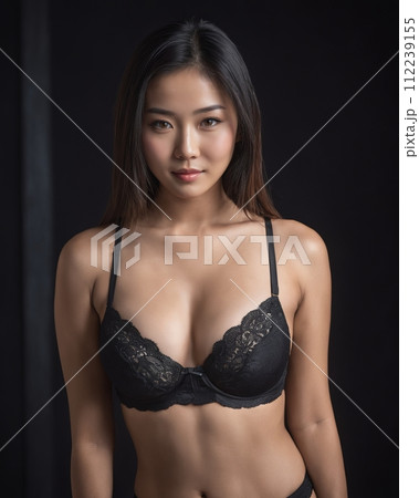 an asian woman wearing a black bra and panties 112239155