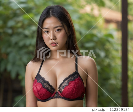 an asian woman wearing a red bra and black underwear 112239184