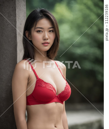 an asian woman wearing a red bra 112239186