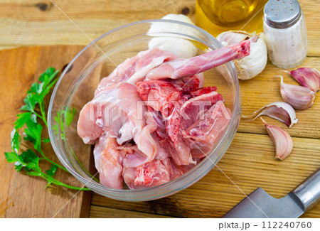 Raw rabbit meat with natural ingredients before cooking 112240760