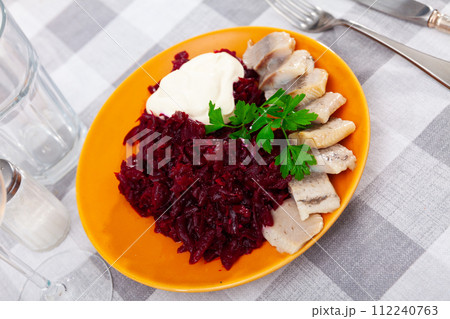 Pieces of herring with beetroot served on plate Pieces of herring with beetroot served on plate 112240763