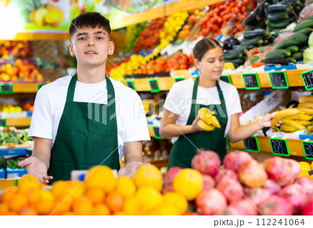 Portrait of a confident guy seller 112241064
