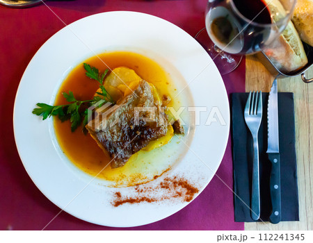 Sliced pork fillet served with potatoes from oven 112241345