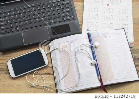 mobile phone, notebook planner, computer and calendar for business work mobile phone, notebook planner, computer and calendar for business work 112242719