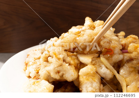 Chinese food with fried pork and sweet and sour sauce Chinese food with fried pork and sweet and sour sauce 112246695