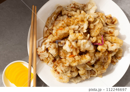 Chinese food with fried pork and sweet and sour sauce 112246697