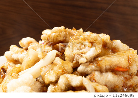 Chinese food with fried pork and sweet and sour sauce 112246698