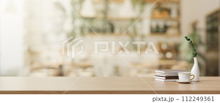 A presentation space on a wooden desk in a beautiful Scandinavian coffee shop. A presentation space on a wooden desk in a beautiful Scandinavian coffee shop. 112249361