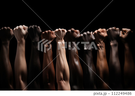 Group of people with raised hands in a row on a black background. 112249486