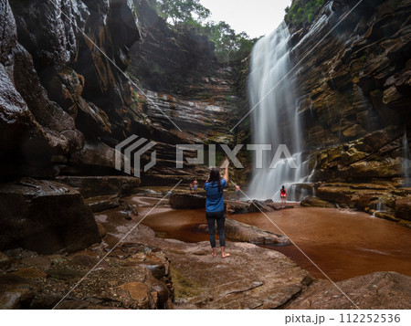 Exploring the Majestic Waterfall in a Serene Wilderness 112252536