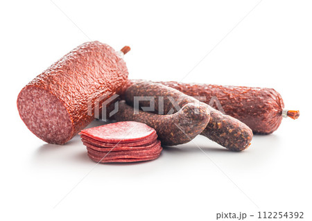 Sliced salami sausage isolated on white background. Sliced salami sausage isolated on white background. 112254392
