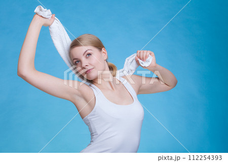 Woman with a towel above her head 112254393