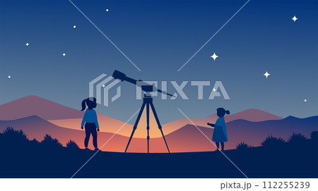 Children exploring the night sky with a telescope 112255239