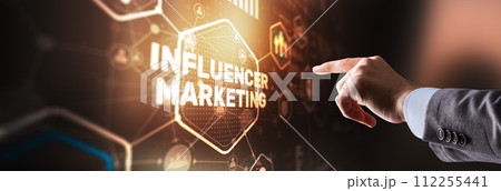 Man clicks on the inscription INFLUENCER MARKETING 112255441