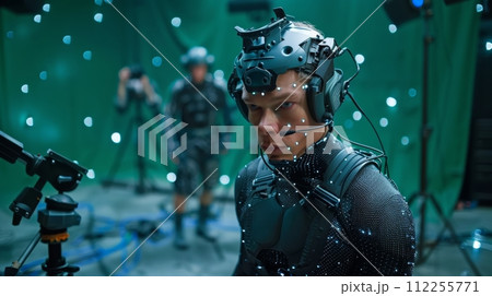 AI-generated content. Big film studio, professional crew shooting blockbuster movie. Using green screen with actor wearing motion tracking suit and head rig. 112255771