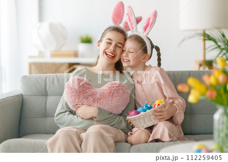 children wearing bunny ears on Easter day 112259405