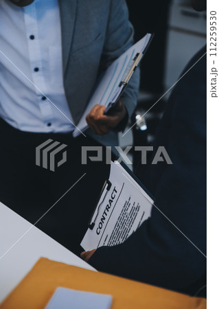 Consultation and conference of Male lawyers and professional businesswoman working and discussion having at law firm in office. Concepts of law, Judge gavel with scales of justice. Consultation and conference of Male lawyers and professional businesswoman working and discussion having at law firm in office. Concepts of law, Judge gavel with scales of justice. 112259530