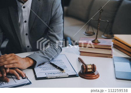 Consultation and conference of Male lawyers and professional businesswoman working and discussion having at law firm in office. Concepts of law, Judge gavel with scales of justice. 112259538