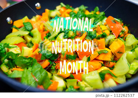 Celebrating National Nutrition Month With a Colorful Array of Vegetables in a Sizzling Pan 112262537