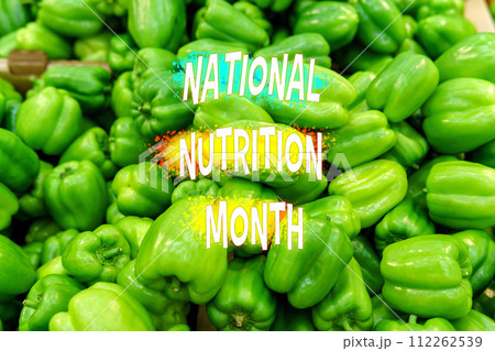 Vibrant Green Bell Peppers Emblazoned With National Nutrition Month Announcement 112262539