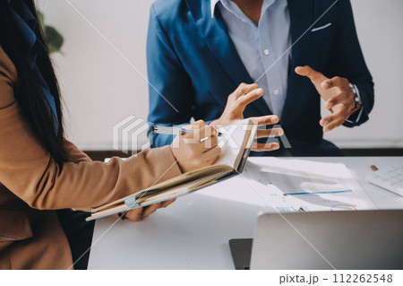 Business team working with new startup project plan and discussion information for financial strategy with laptop and digital tablet in a modern business lounge. 112262548